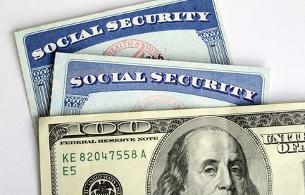 social security cards and $100 bill