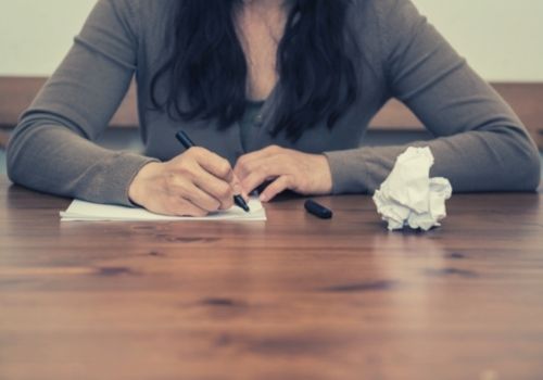 Woman writing a disability appeal letter