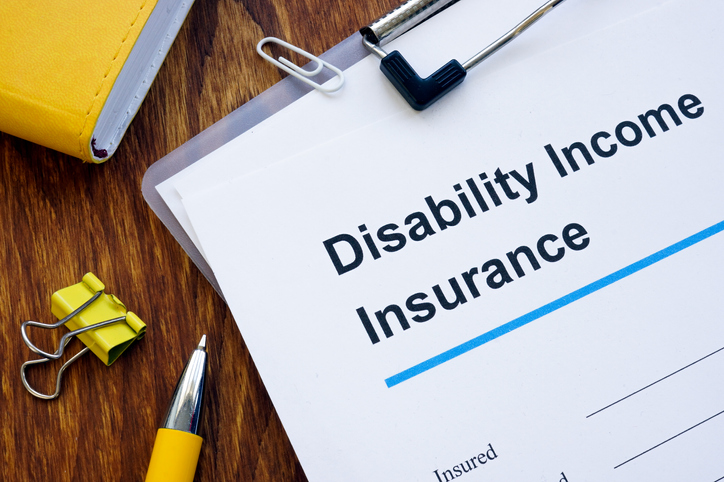 Disability Income DI Insurance application form and pen.