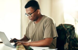 A veteran uses a computer to learn about claims and what the Veterans Benefits Management System (VBMS) is.