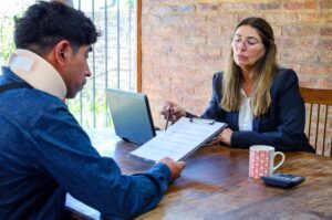 A lawyer reviews claim documents with a client after a Long Term Disability denial in Lake Charles, Louisiana.