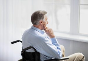 Man sitting in a wheelchair who may be unsure about what it means to have a 70 percent VA disability