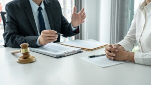 Lawyer meets with client who needs disability benefits for a knee replacement.