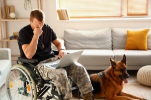 A veteran on his computer, wondering if VA disability benefits count as income.