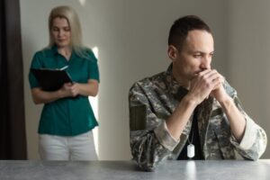 A veteran sitting at a table who may be unsure about what the VA rating for diabetes is